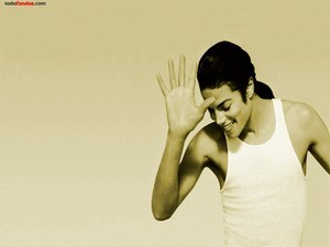 Michael Jackson, smiling, in undershirt