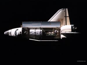 Space Shuttle Atlantis carrying a satellite