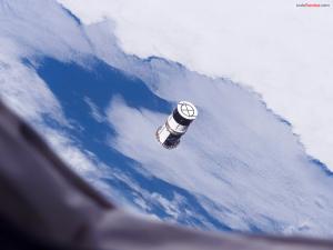 Cylindrical satellite orbiting around the planet Earth