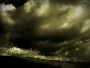 Windmills under a dark sky