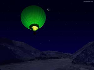 Green balloon flying at night