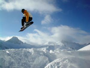 A big jump of snowboard
