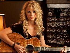 Taylor Swift playing guitar