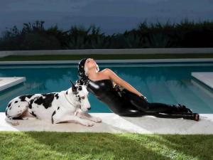 Lady Gaga with a dog in the pool