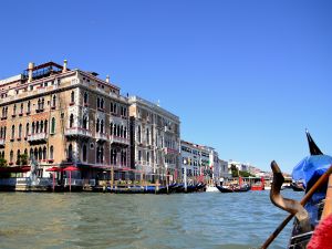 Gondola ride through one of the main canals of Venice (Italy)