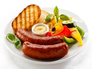 Dish with sausage, bread and vegetables