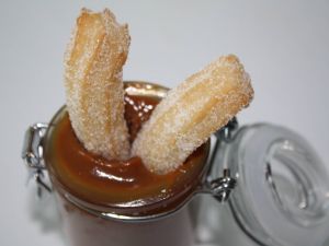 Churros in a boatload of chocolate