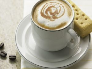 Coffee with milk and a cookie