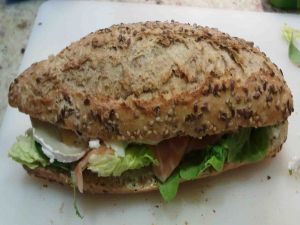 Multigrain bread with goat cheese, lettuce and salmon