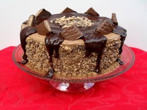 Cake with chocolate, caramel and nuts