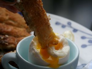Dipping bread in the egg yolk