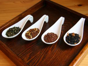 Spoons with different kinds of tea