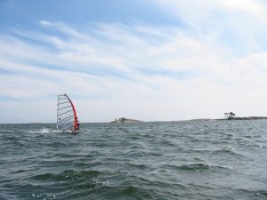 Alone at sea practicing windsurf