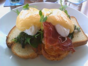 Eggs Benedict with bacon and spinach