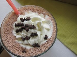 Chocolate milkshake with cream and chocolate pearls