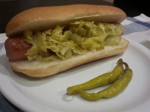 Hot dog with cabbage and two chillies