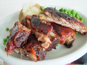 Plate of ribs with peas