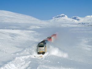 Train pushing his way through snow