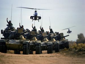 Cobra Helicopters over some tanks