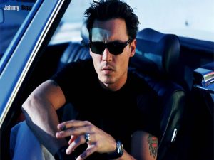 Johnny Depp sitting in a car