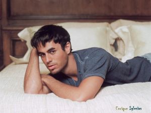 Enrique Iglesias lying on the bed