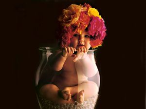 Baby with a hat of flowers