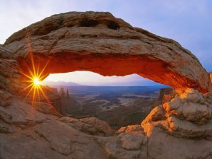 The sun on a rock arch