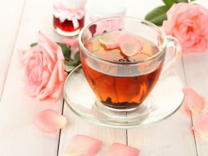 Cup of tea with rose petals