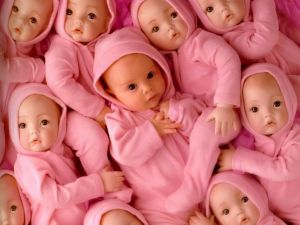 Baby surrounded by dolls