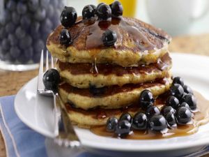 Pancakes with honey and blueberries