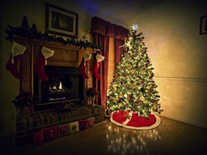 Christmas tree beside the fireplace