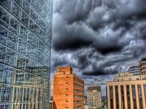 Black clouds over buildings