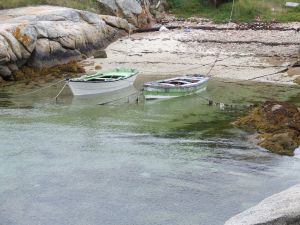Two boats on a small beach of Galicia, Spain